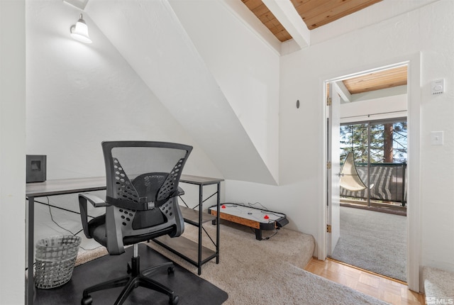 office space featuring light parquet flooring, wood ceiling, and vaulted ceiling with beams