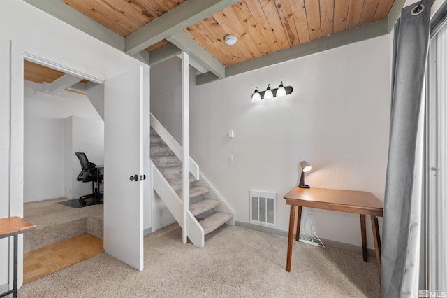 staircase featuring parquet flooring and wooden ceiling