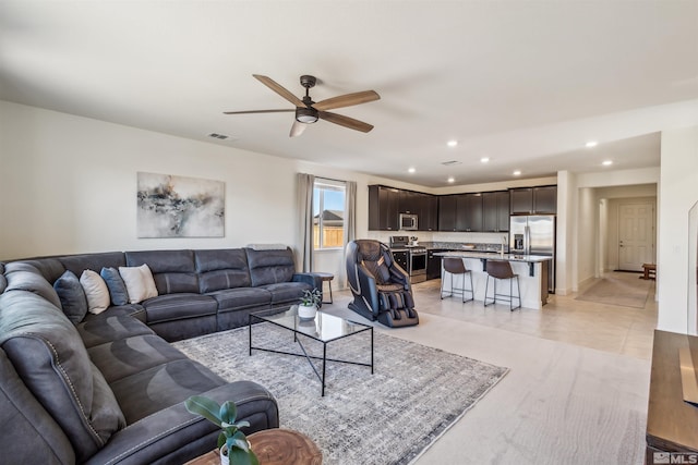 living area featuring a ceiling fan, recessed lighting, visible vents, and light tile patterned floors