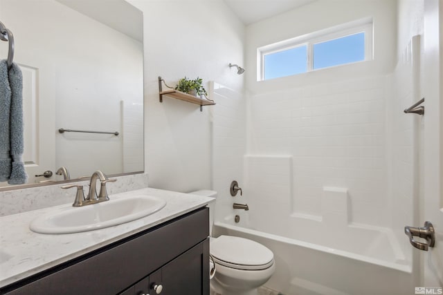 bathroom with toilet, shower / bathtub combination, and vanity