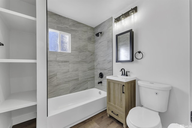 full bathroom with toilet, vanity, tiled shower / bath combo, and hardwood / wood-style flooring