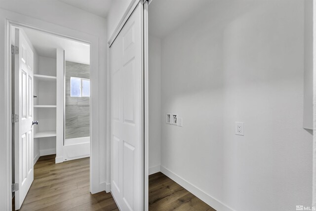 hallway with dark wood-type flooring