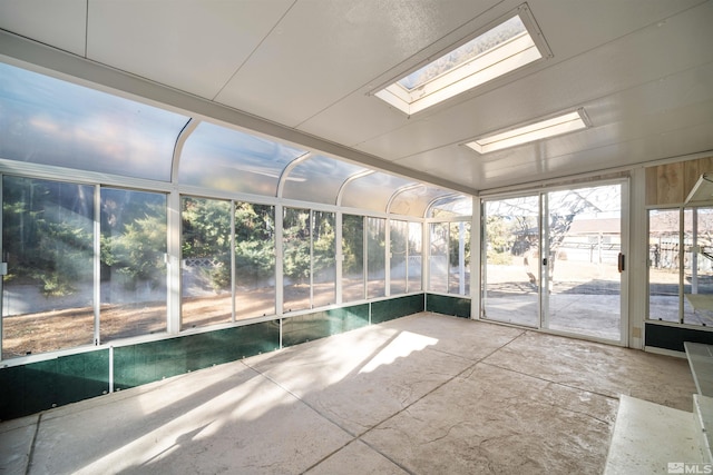 unfurnished sunroom with a skylight