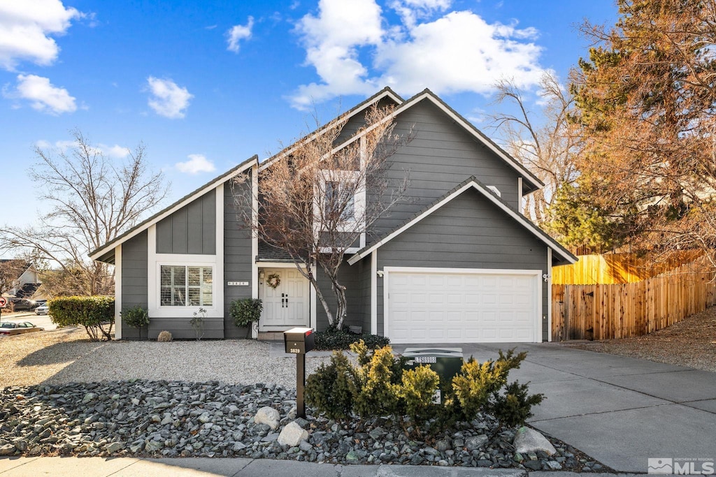 view of front property with a garage and central AC