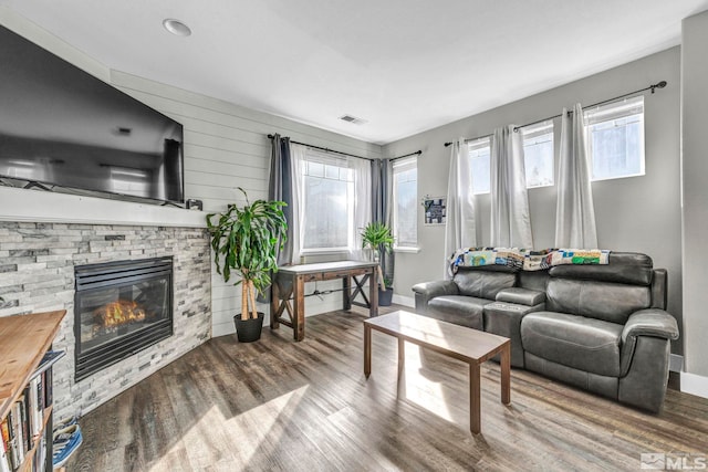 living room featuring a fireplace and hardwood / wood-style floors