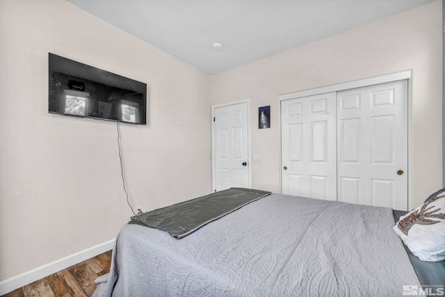 bedroom featuring a closet and hardwood / wood-style flooring