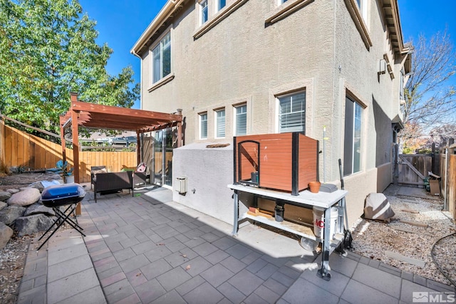 view of patio featuring grilling area and a pergola