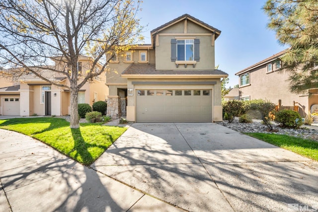 view of front of house with a front yard and a garage