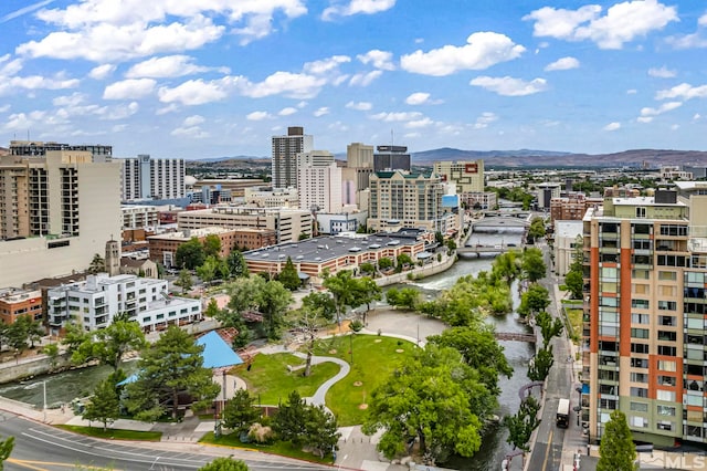 property's view of city featuring a mountain view