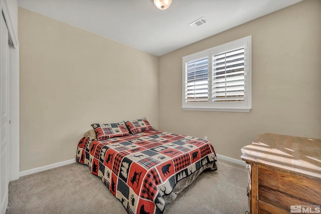 carpeted bedroom with a closet