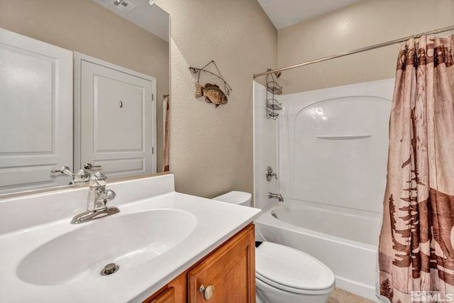 full bathroom featuring toilet, shower / bath combo, and vanity