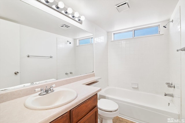 full bathroom with toilet, a wealth of natural light, bathing tub / shower combination, and vanity