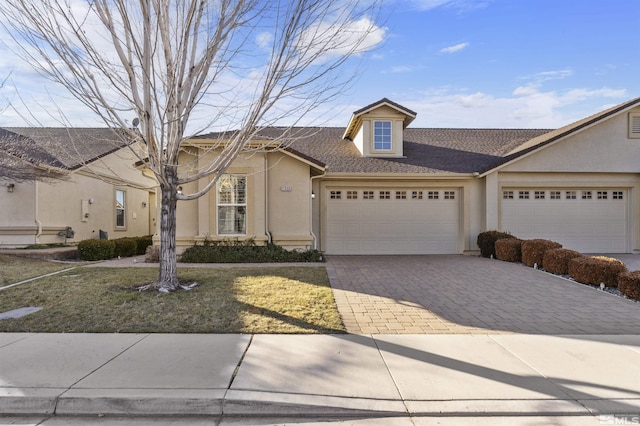 view of front of house featuring a front yard and a garage