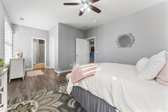 bedroom featuring ceiling fan and dark hardwood / wood-style flooring