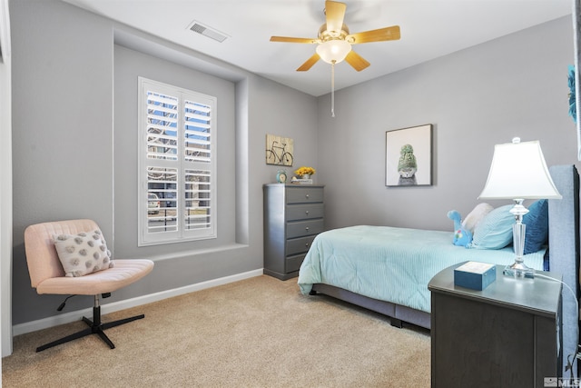 bedroom featuring ceiling fan and light colored carpet