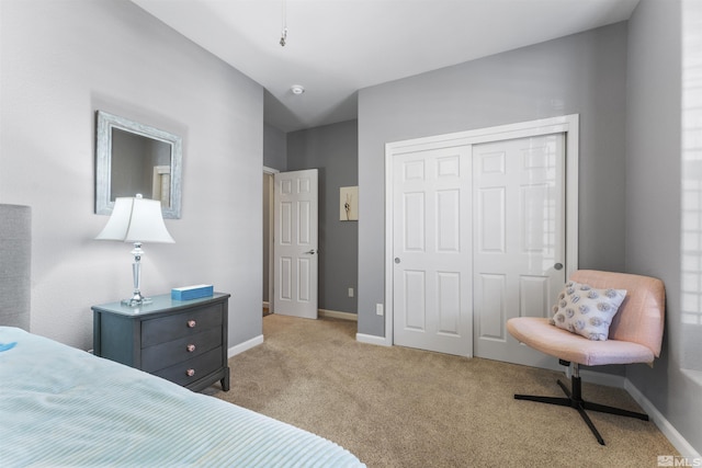 bedroom with light colored carpet and a closet