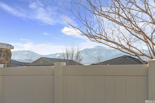 yard covered in snow with a mountain view