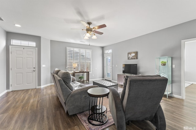 living room featuring ceiling fan and wood-type flooring