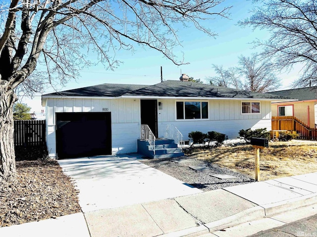 single story home featuring a garage