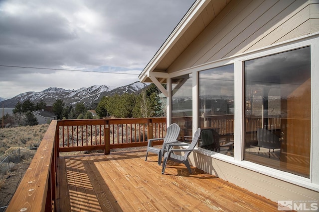 wooden deck with a mountain view