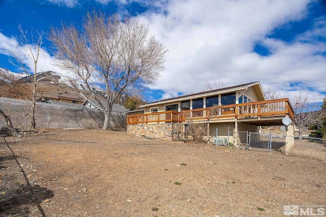 rear view of property with a deck