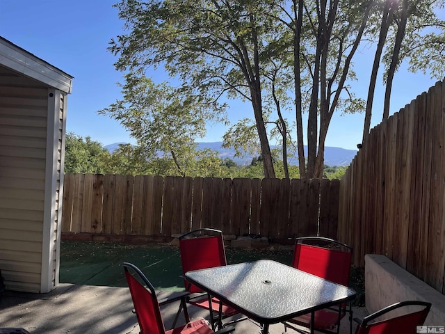 view of patio / terrace with a fenced backyard and outdoor dining area