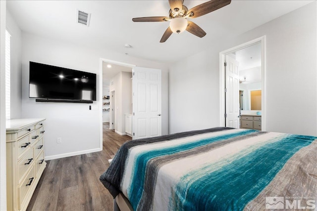 bedroom featuring ceiling fan, connected bathroom, and dark hardwood / wood-style floors