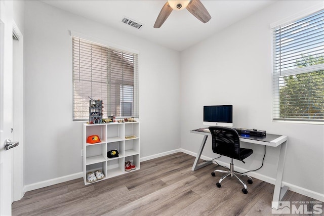 office with ceiling fan, a healthy amount of sunlight, and light hardwood / wood-style floors