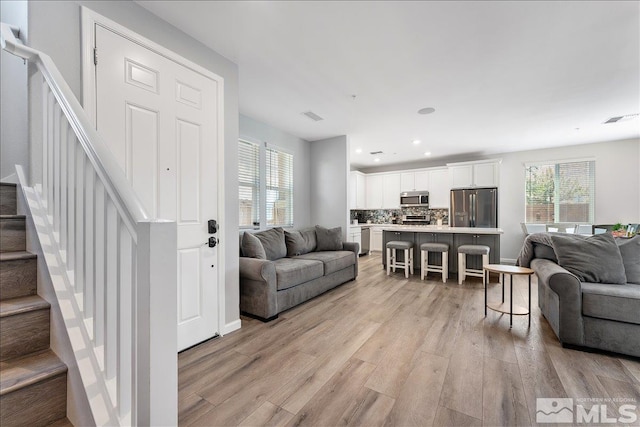 living room with light hardwood / wood-style floors