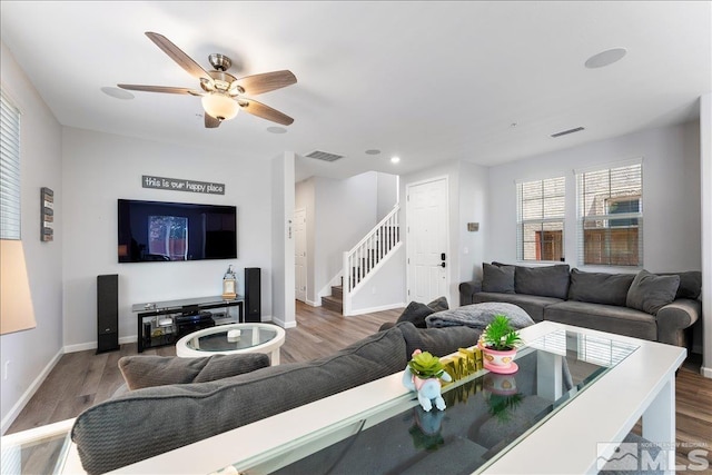 living room with ceiling fan and wood-type flooring