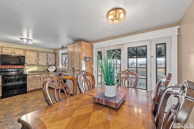 dining area with a wealth of natural light