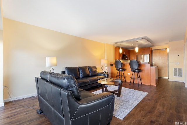 living room featuring dark hardwood / wood-style floors