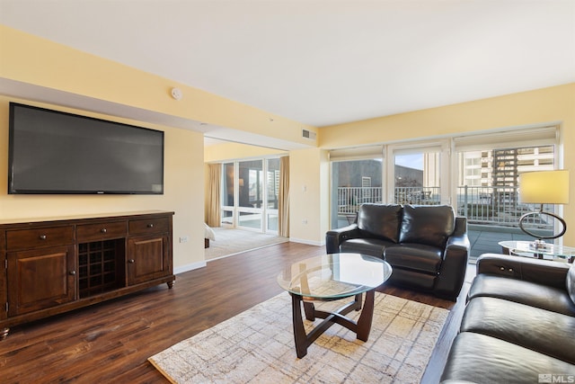 living room with dark hardwood / wood-style flooring