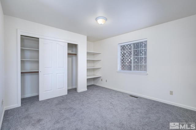 unfurnished bedroom featuring carpet