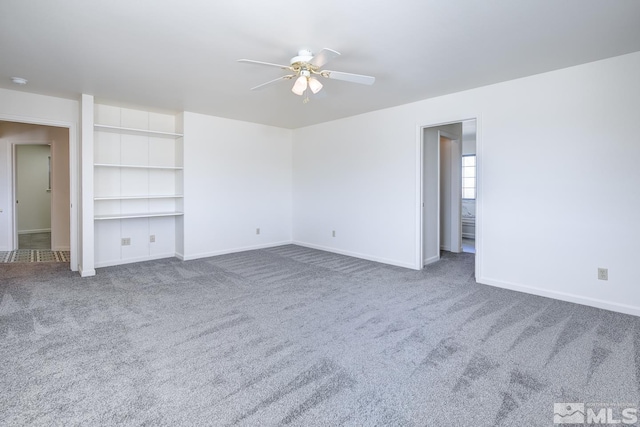 unfurnished living room with carpet, ceiling fan, and built in features