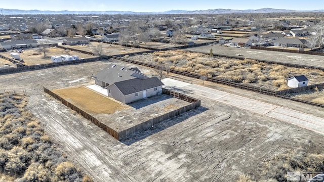 birds eye view of property featuring a mountain view