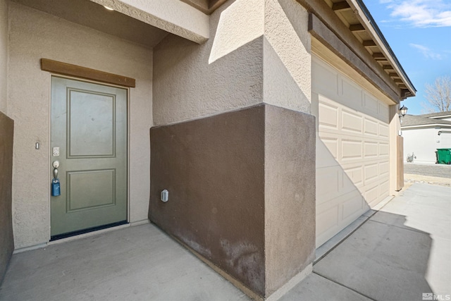 property entrance featuring a garage