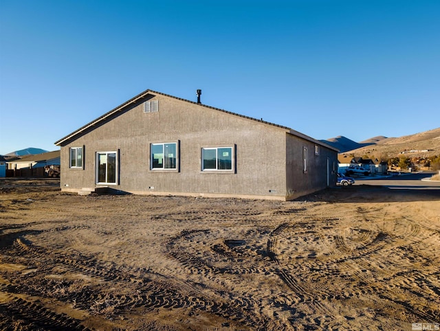 rear view of property with a mountain view