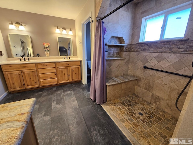 bathroom featuring vanity, a shower with curtain, and toilet