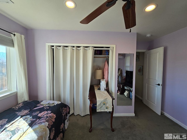 carpeted bedroom with a closet and ceiling fan