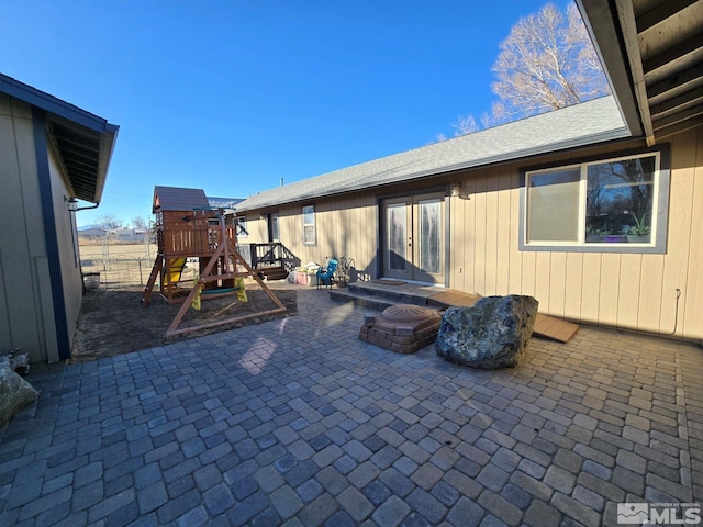 view of patio featuring french doors and a playground