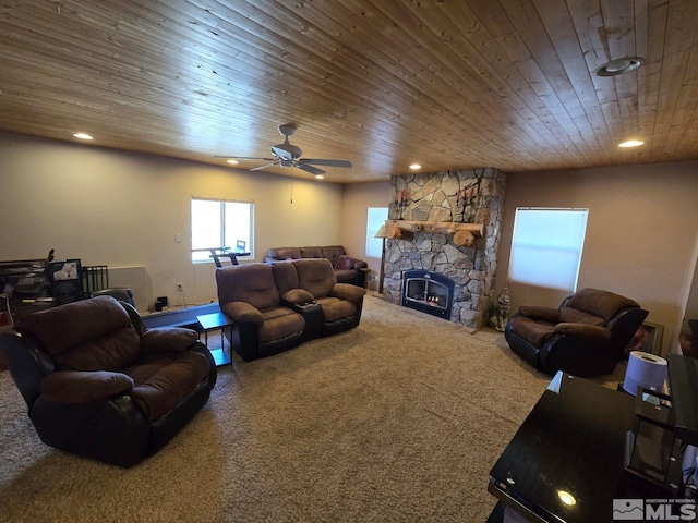 living room featuring carpet floors, wood ceiling, a fireplace, and ceiling fan