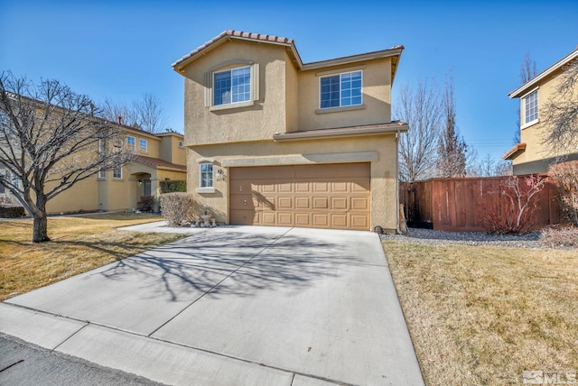 view of front of property with a garage and a front lawn