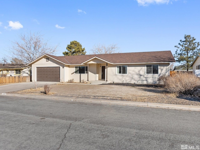 ranch-style home featuring a garage