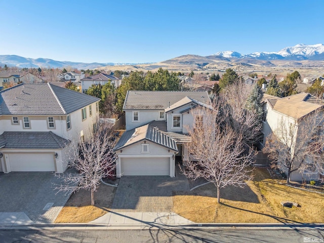 birds eye view of property featuring a mountain view