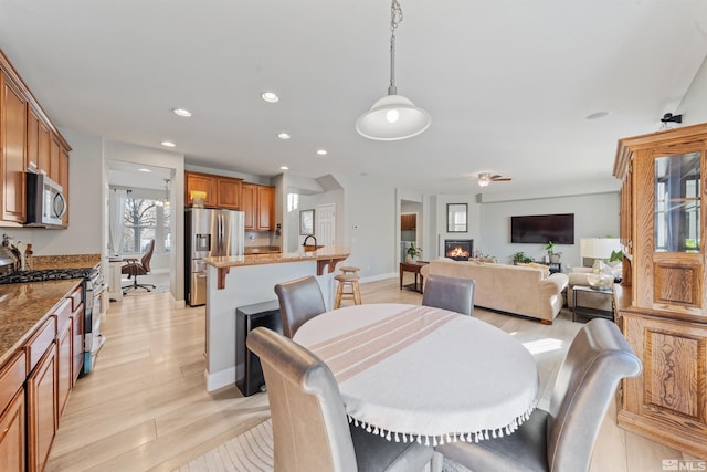 dining area with light hardwood / wood-style floors