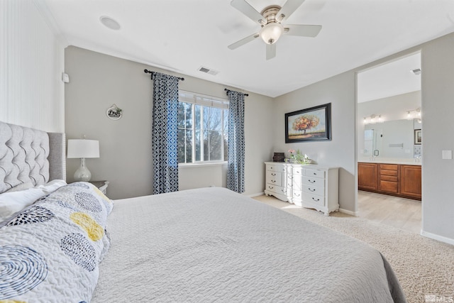 bedroom featuring ceiling fan and ensuite bathroom