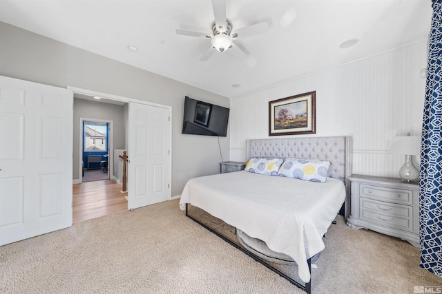 bedroom with light carpet and ceiling fan