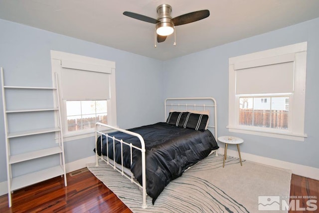 bedroom featuring dark wood-type flooring and ceiling fan