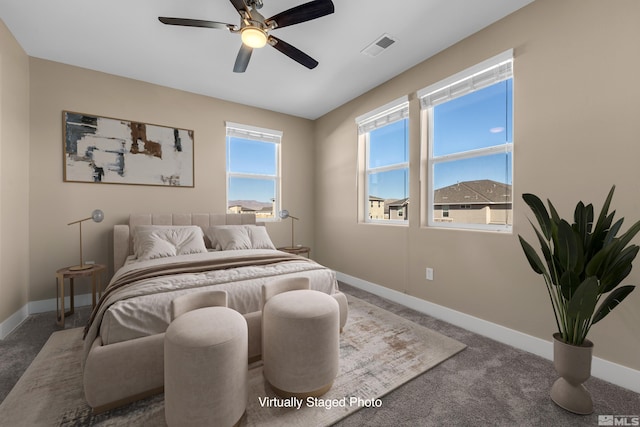 bedroom with ceiling fan and carpet